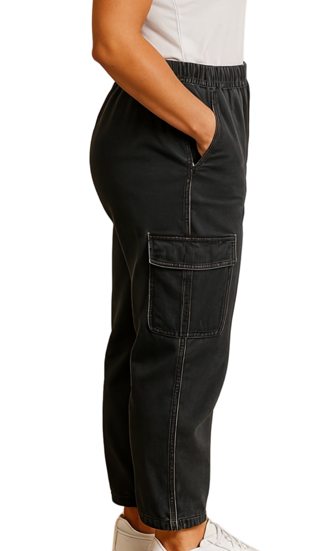 Black cargo pants worn by a person on a white background